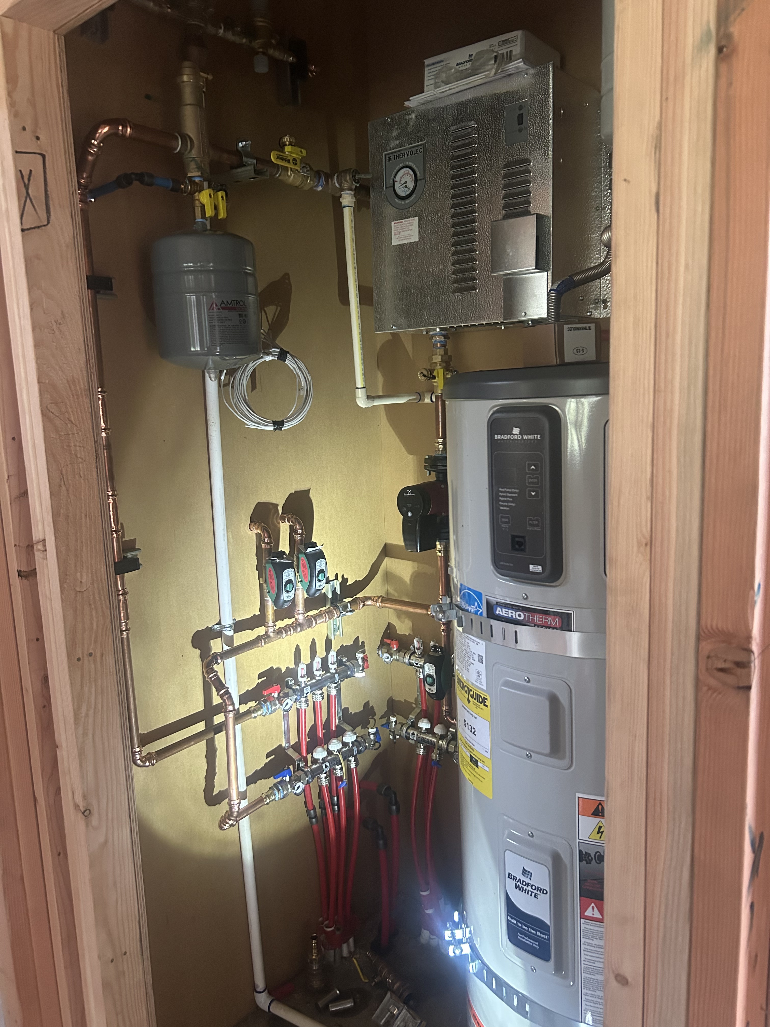 Hydronic Boiler Copper Header & Circulator Pumps (Detail Close-Up)